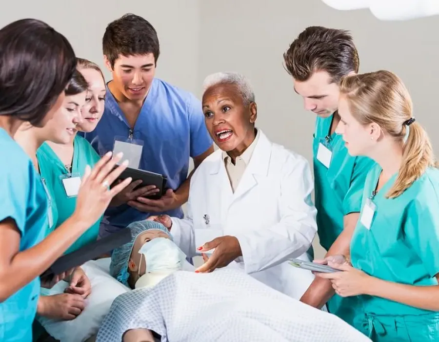 Nurse educator leading class discussion in laboratory experience